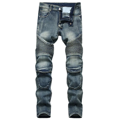 Blue denim jeans with knee patches on a white background
